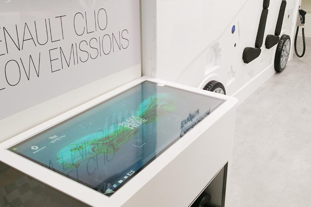 A futuristically designed touch screen interface, built into bespoke low tables, comprised two Multi-taction screens.